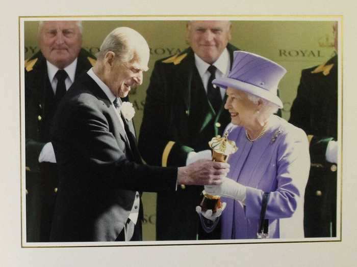 2012: The Duke of Edinburgh is seen presenting his wife with a trophy after her horse won the Queen