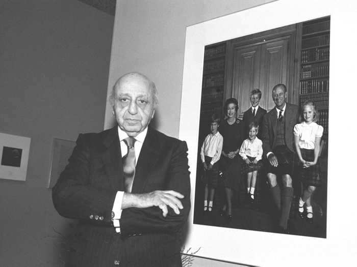 1987: Photographer Yousuf Karsh stands next to this portrait of the Queen and her grandchildren. The image appeared on their 1987 Christmas card.