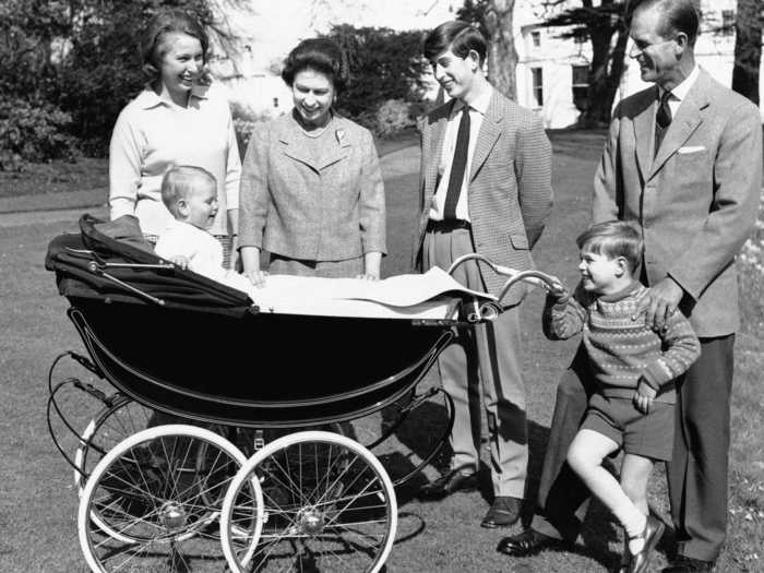 1965: Members of the royal family delight over 1-year-old Prince Edward in this image taken at Windsor Castle.