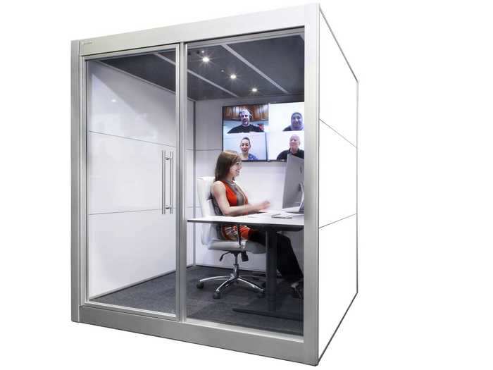 The SnapCab Work and the larger Work+ both include a table with adjustable height options inside the enclosed space.