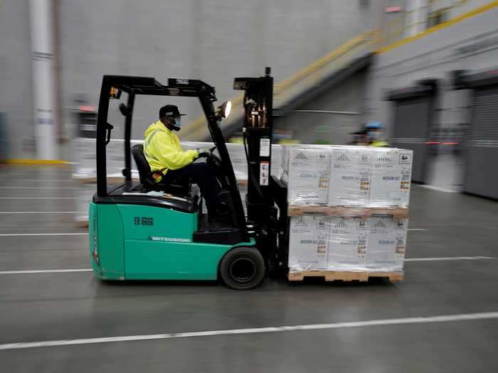 Once the vaccines are nestled in boxes, warehouse workers use machinery to load them onto trucks. The trucks will either head to various locations themselves, or drive to planes that are tasked with taking the vaccines to more distant locations.