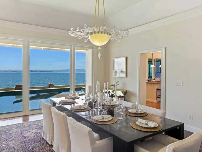 The formal dining room even has designer chandeliers.