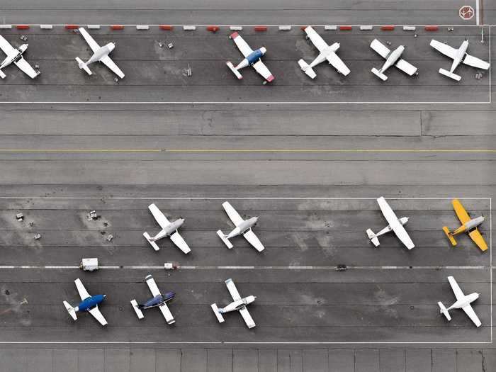 Once he started shooting, however, he also saw the beauty in the symmetry of airports and the grounded planes.