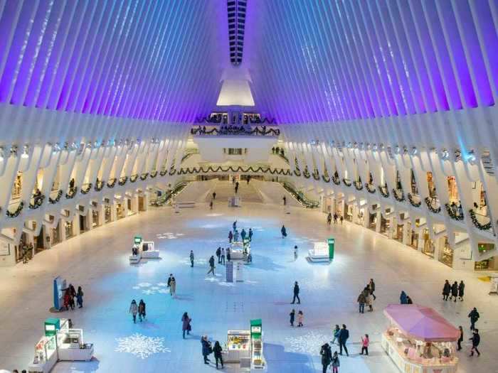 The Oculus Transit Hub in New York City shines with snowflakes and blue lights.