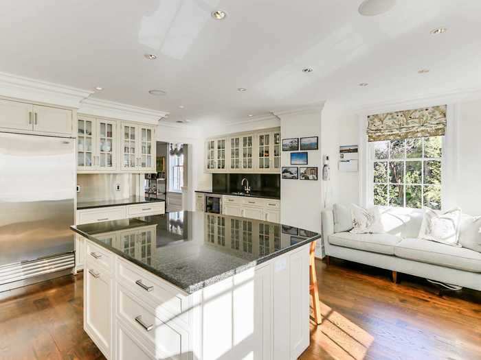 The kitchen also includes a breakfast bar and a butler