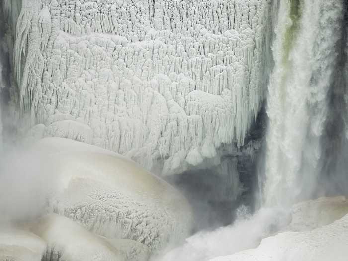 Sheets of ice that form on the rocks next to the falls look like natural works of art.