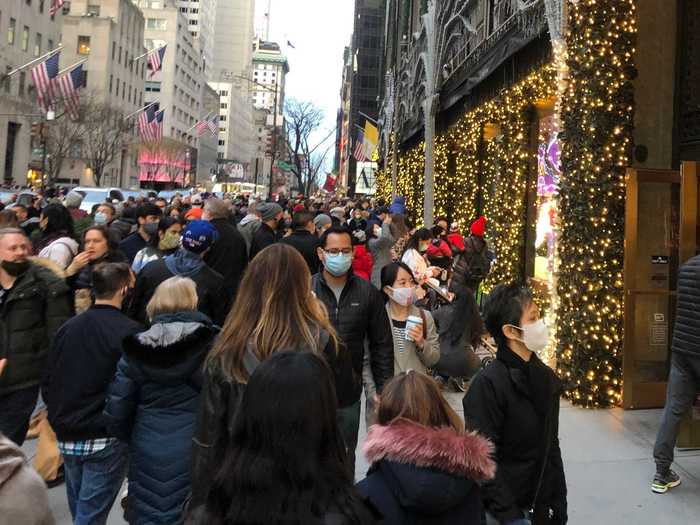 After shopping in Five Below, I went back outside and found an even larger crowd by the famous windows of Saks Fifth Avenue.