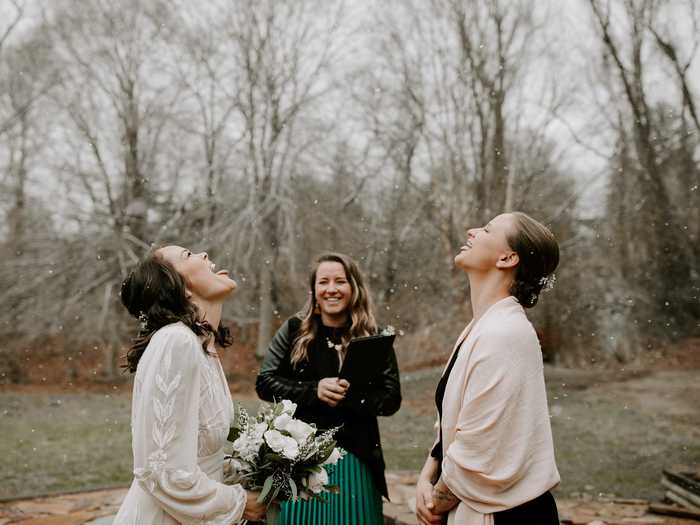 This sweet snapshot of two brides catching snowflakes in Asheville, North Carolina, will surely bring a smile to your face.