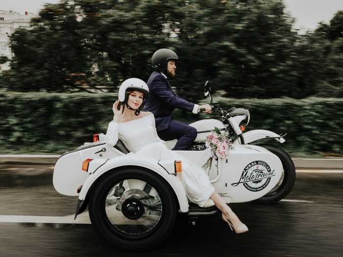 In Moscow, Russia, these newlyweds are making their escape with a motorcycle and sidecar.