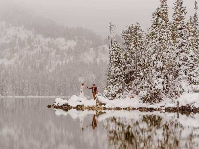 This bride and groom are definitely walking in a winter wonderland - or maybe just a typical Colorado vista.