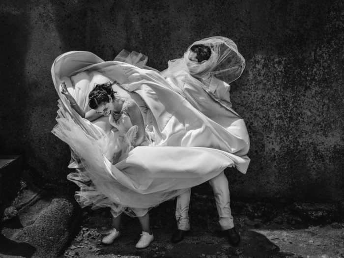 This photo manages to make a windy day and a wedding dress look like a piece of moving art in Sintra, Portugal.