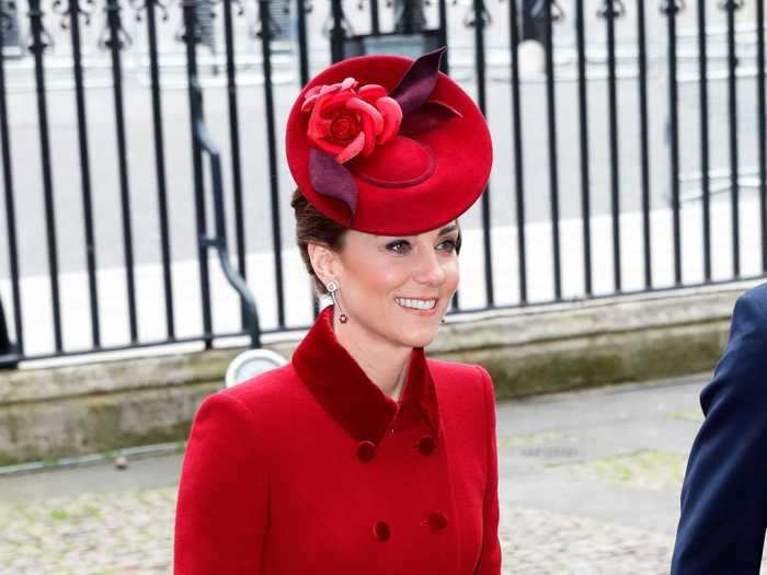 She has reworn this red Catherine Walker coat several times.