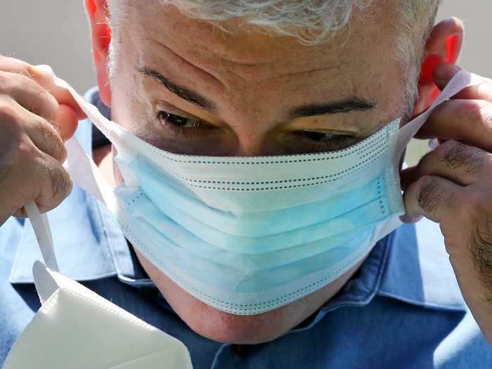 Another highly protective option is to layer a surgical mask with a cloth one.