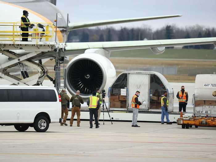 US Marshals were also on hand at the airport as the massive containers were loaded onto the Boeing 757-200F, alongside standard boxes.