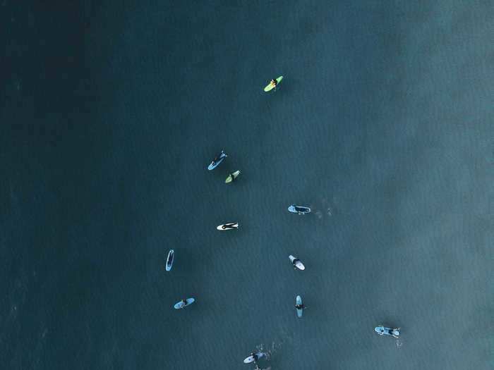 "Tiny surfers paddling from above always reminds me of tiny fishes" by Ilaria Ronchi