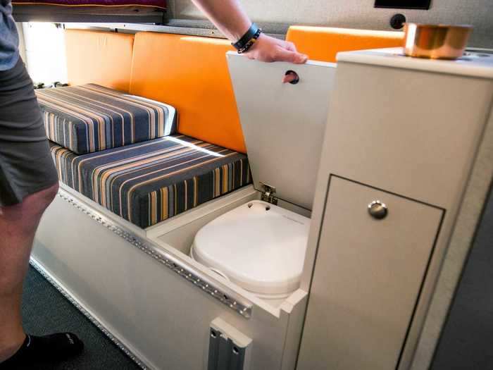 The dinette seating area also has a hidden storage system that tucks away the 2.6-gallon portable toilet, according to Outside Van