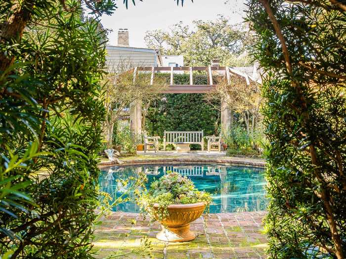 Another garden is complete with a pool. The listing says it is one of the first pools ever made in downtown Charleston.