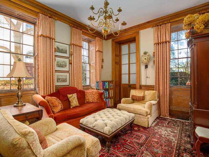 Built in 1745, the home has a total of 15 fireplaces and a cypress-paneled library.