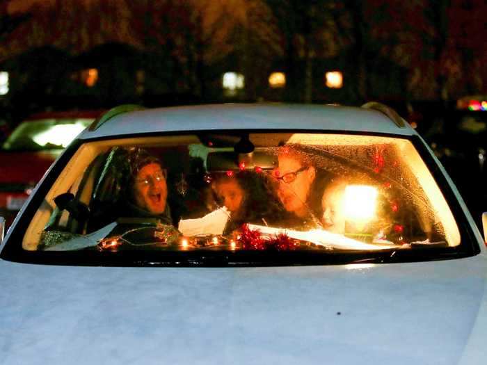 Instead of knocking on your door, carollers in Milton Keynes, Britain, sang at a drive-in carol service organized by a local church.