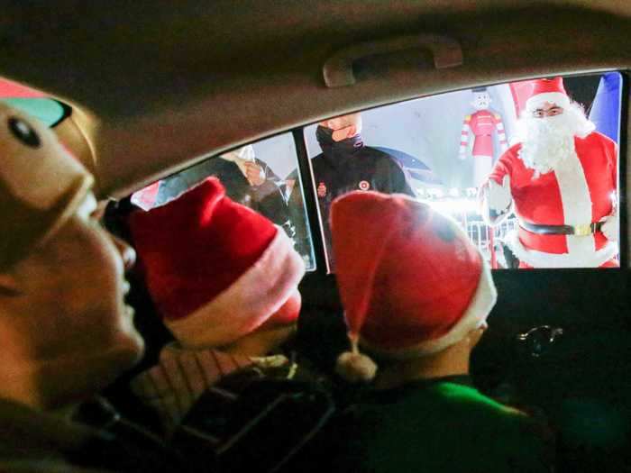 At a drive-thru Christmas village in Ciudad Juarez, Mexico, patrons could greet Santa from the comfort of their cars.