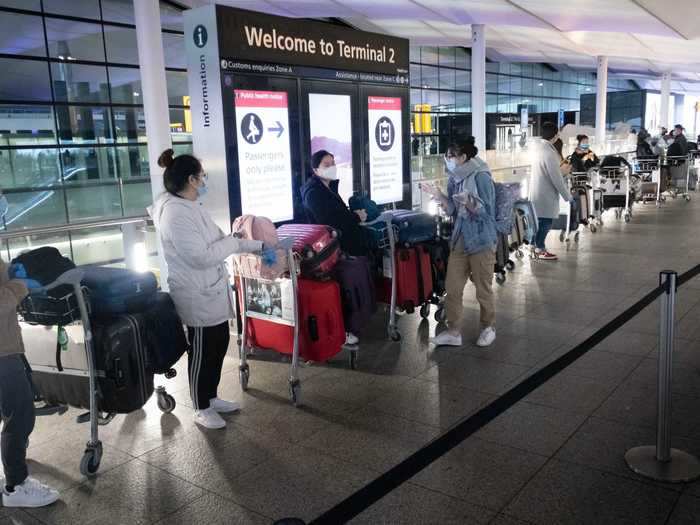 Similar queues formed at Heathrow Airport on Sunday to board last-minute flights before airlines began cancellations.