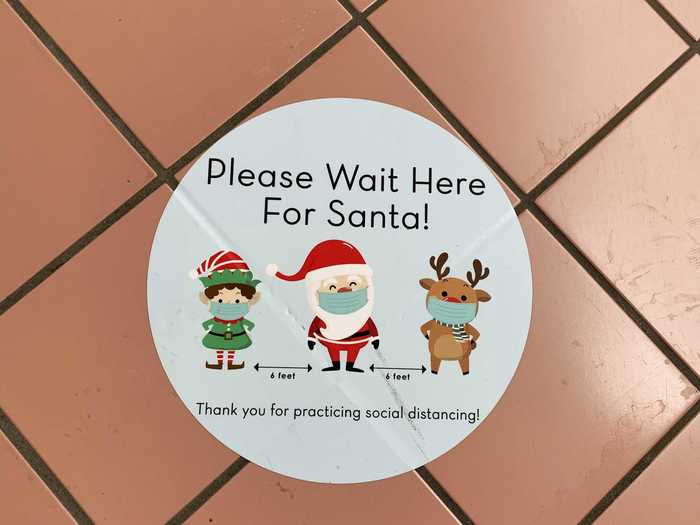 More social-distancing stickers told customers waiting to meet Santa where to stand, although there were no takers either time I walked by.