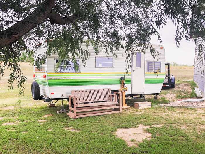 Heap left the outside of the trailer as it was, aside from getting new tires.  She named her trailer Fern, inspired by the green stripes.