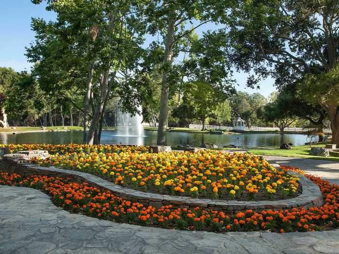 ... full of stonework and colorful flower beds.