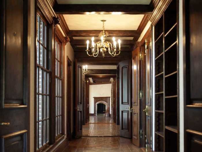 A hallway lined with windows connects you from the dining room to other rooms on the first floor.