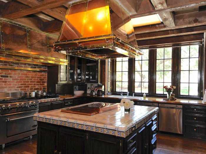 Walking back through the main foyer under an arched doorway brings you to the newly renovated kitchen.