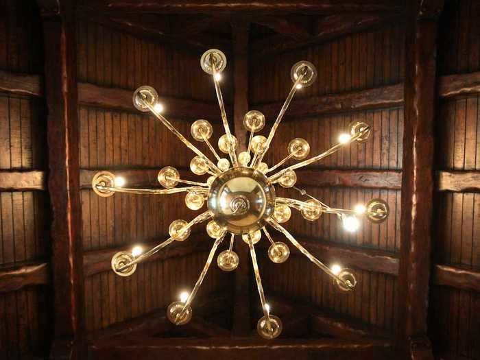 Large golden chandeliers hang over the lofted main entryway.