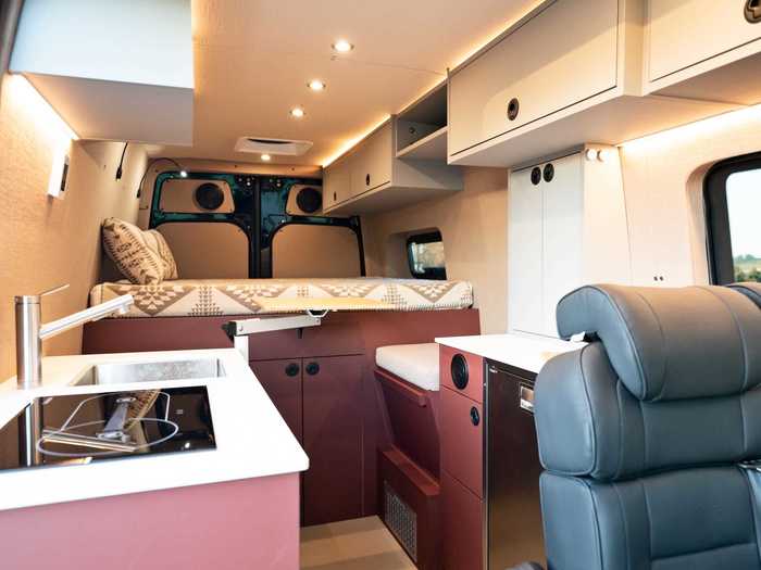 If eating by the bed is more preferable, van occupants can sit on either side of the rear table atop two cushioned seats.
