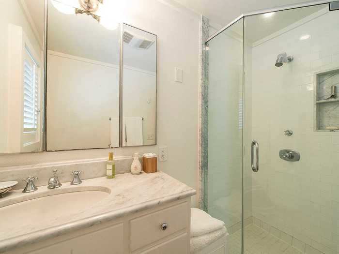 ... and a bathroom with marble countertops.