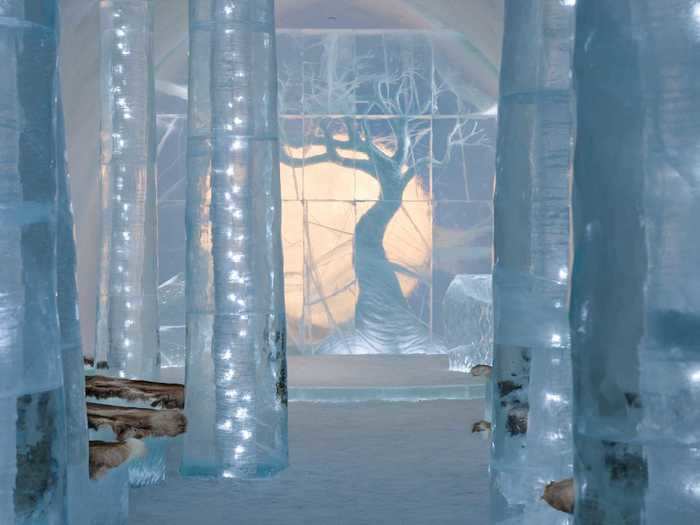 Icehotel teamed up with Swedish artists Anna Öhlund and John Pettersson to create the Ceremony Hall Skogen - a frozen forest.