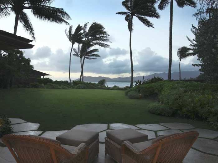 Outside is a private patio with lounge chairs looking toward the ocean.