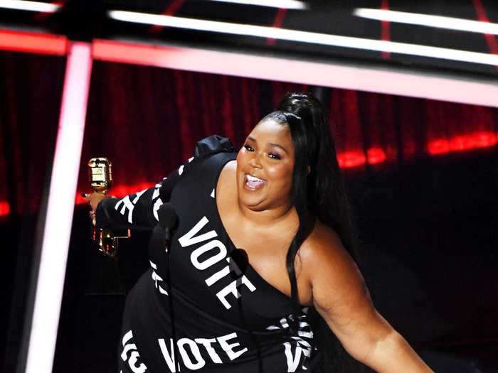 Later in the month, at the Billboard Music Awards, Lizzo wore a custom Christian Siriano black dress with "vote" printed all over it in bold white font.