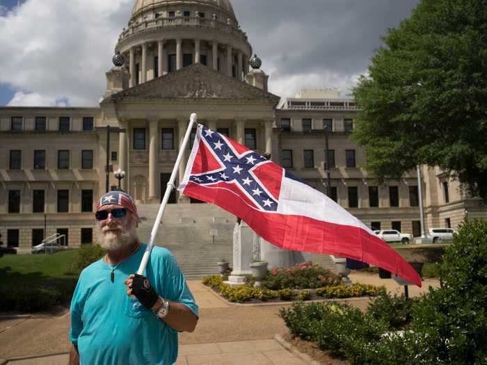 Mississippi removes the Confederate emblem on its flag.