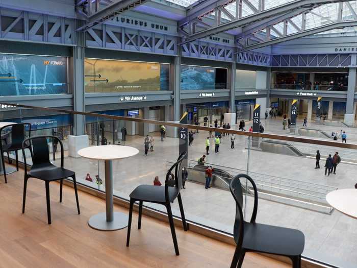 Tables and chairs on the balcony offer a unique people-watching opportunity.