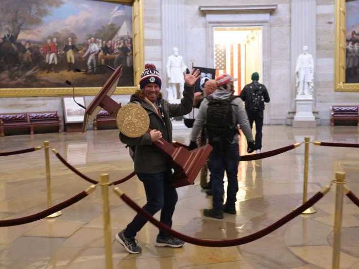 Another protester appeared to steal a podium.