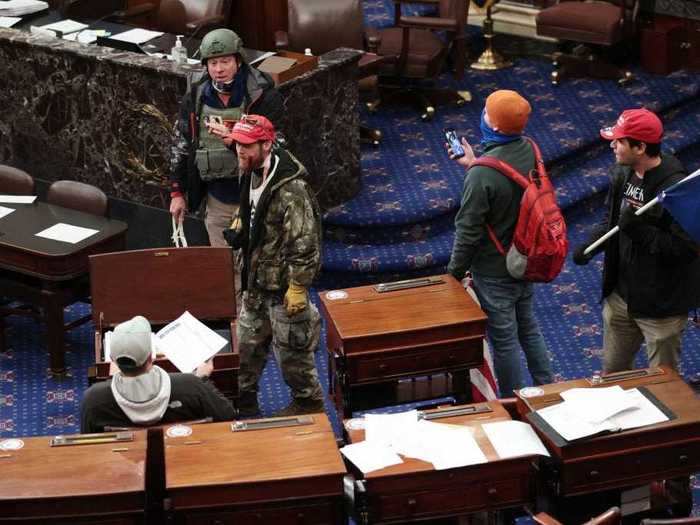 Rioters rifled through desks in the Senate Chamber.