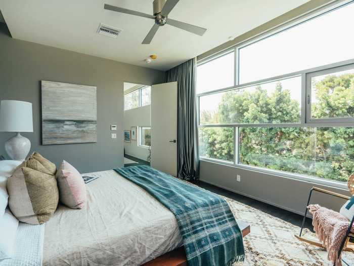 The master bedroom has stunning views of the surroundings ...