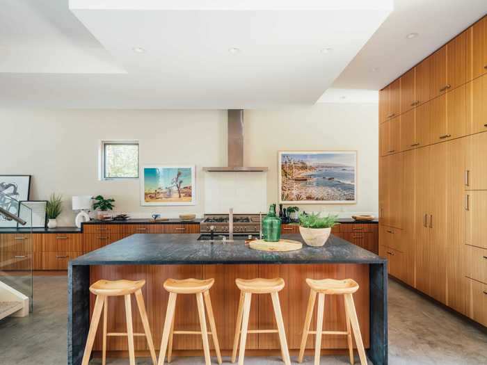 The ground floor also has a large kitchen with soapstone counters and a breakfast bar.