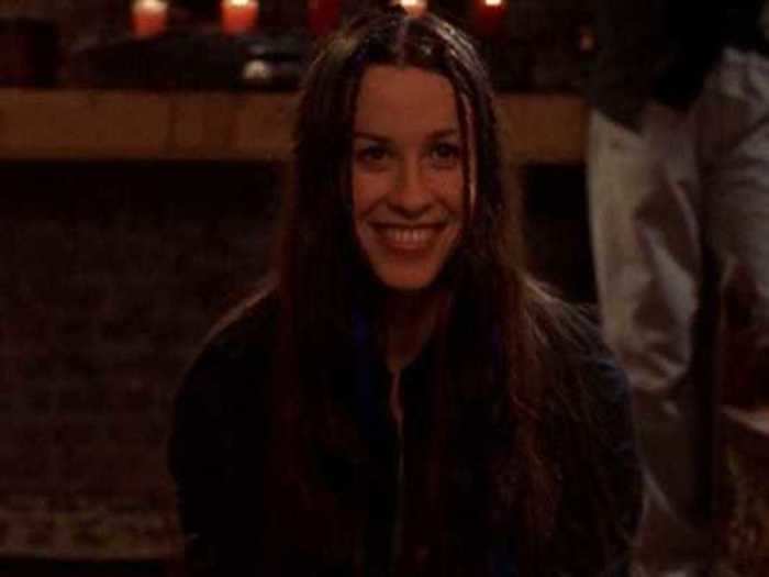 Singer Alanis Morissette kisses Carrie in a game of spin-the-bottle.