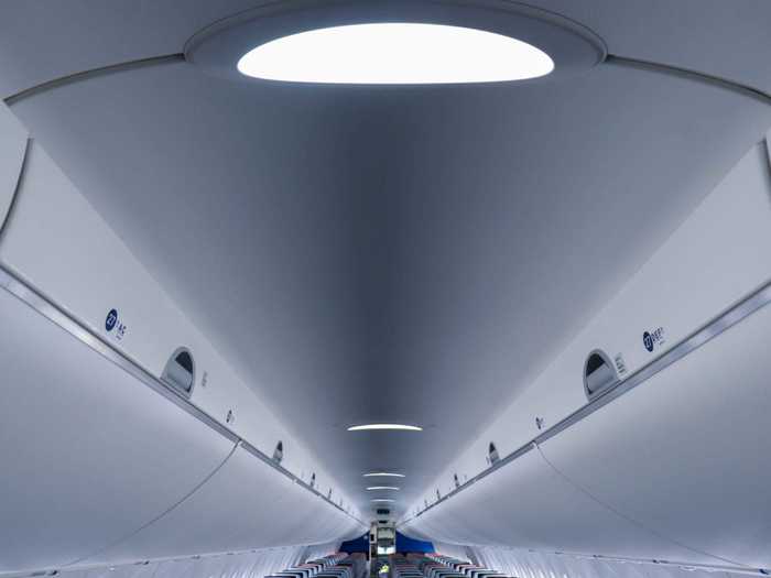 Above the cabin are these skylights, which turn into mood lights during the flight. Passengers will also notice music playing during boarding.