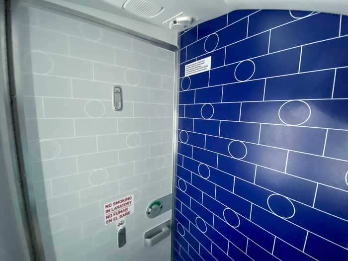 Inside, the lavatory walls feature a subway tile pattern in homage to JetBlue being New York