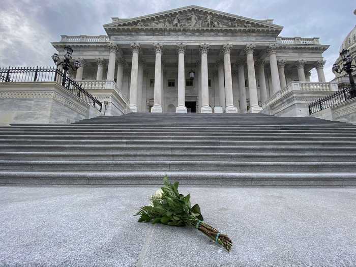 And at some point on Monday afternoon, a person had laid this bouquet of flowers at the foot of the House of Representatives.