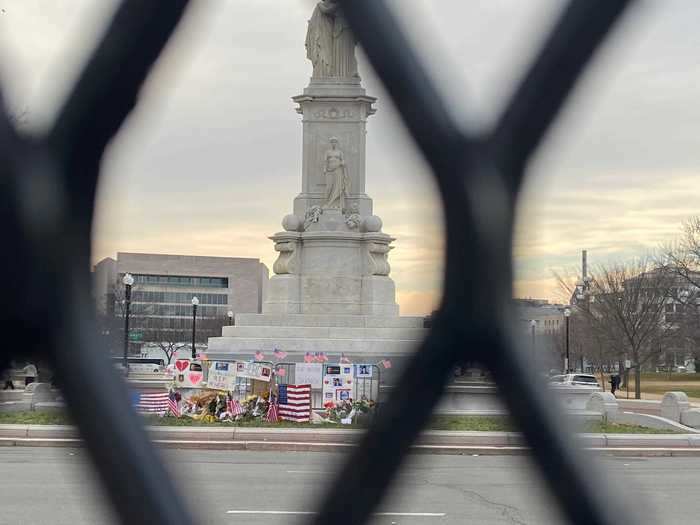 Looking through the fence on the west side of the Capitol, I saw people had created a small memorial to the two dead police officers who were working during the January 6 riot.