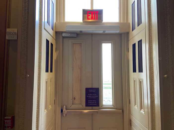 This emergency door in the Senate also had one of its panes smashed.