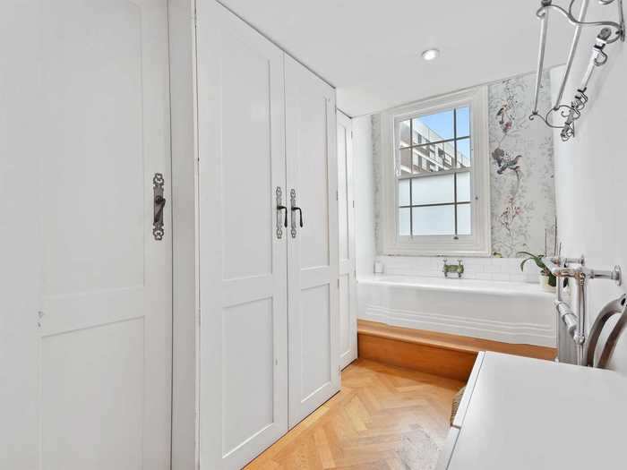 The bathroom also doubles up as a closet, which illustrates how every bit of space is utilized throughout the property.