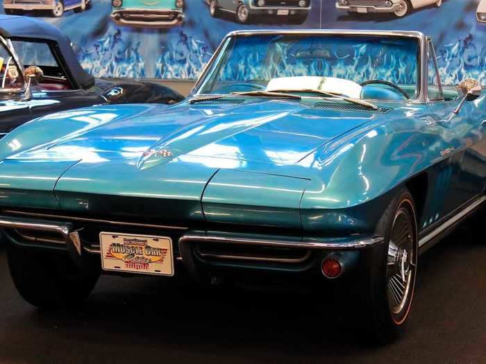 This is a blue 1965 Chevrolet Corvette Fuelie convertible.